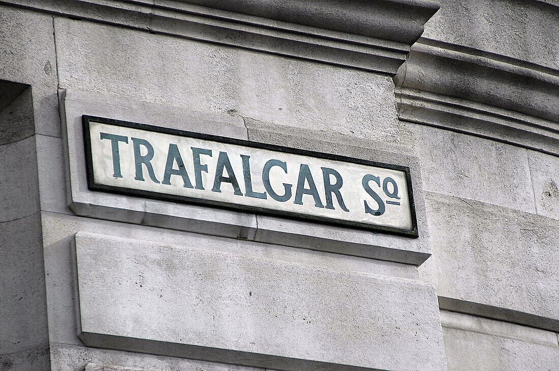Trafalgar Square street sign, on a building in Trafalgar Square, London, England.
