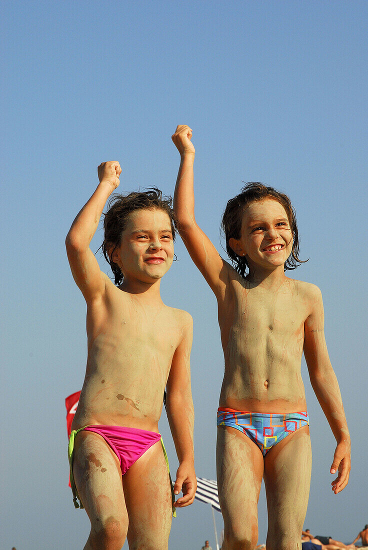 Happy 6 year old girls on Bolonia beach, … – License image