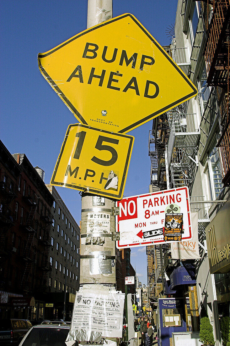 Street signs, no parking, bump ahaead, NYC. USA