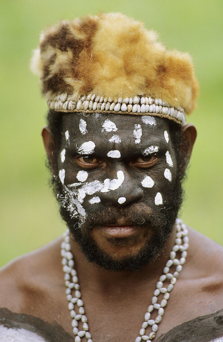 Portrait of an Asmat man with painted face and head-dress, Western Papuasia, Former Irian-Jaya, Indonesia