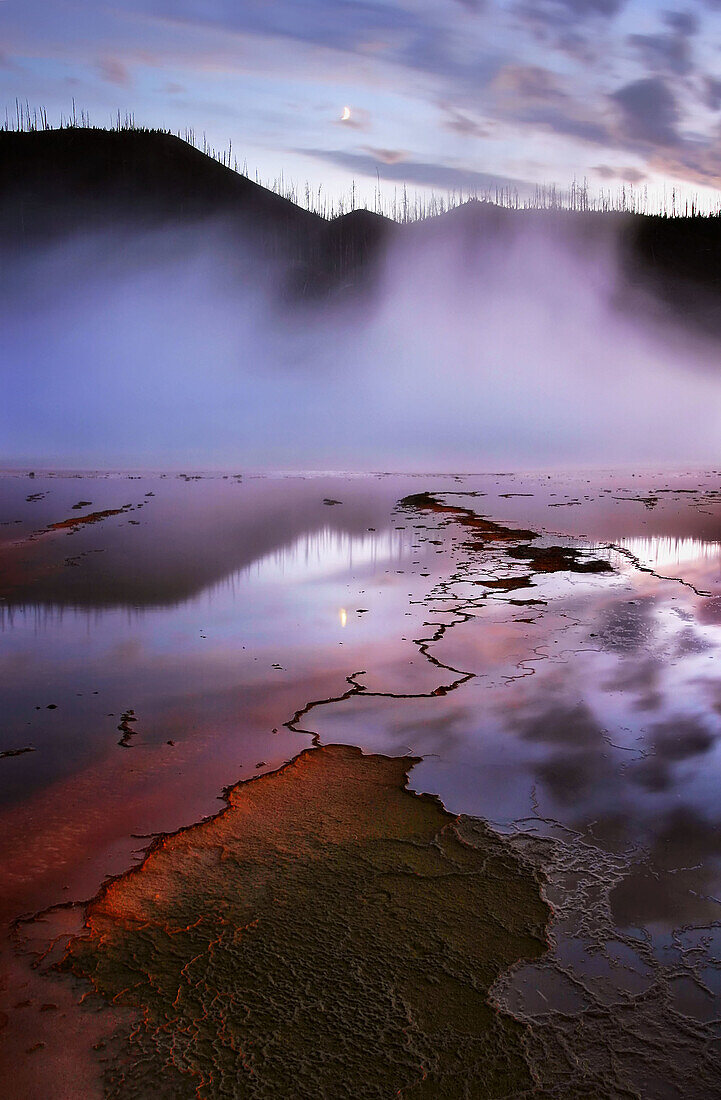 The Grand Prismatic Spring at dusk in Yellowstone National Park Wyoming