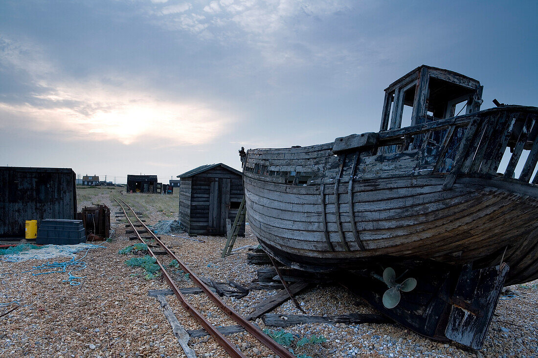 Abandoned fishing boats on the beach, Dungeness, Kent, England, Europe