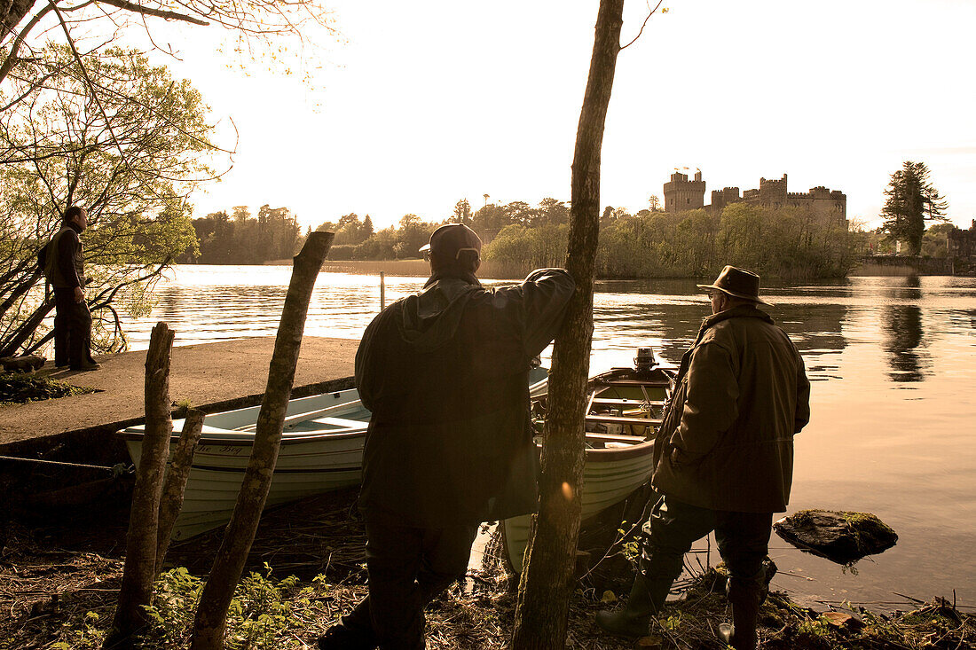 Anglers on the edge of a lake at Ashford Castle near Cong, County Mayo, Ireland, Europe