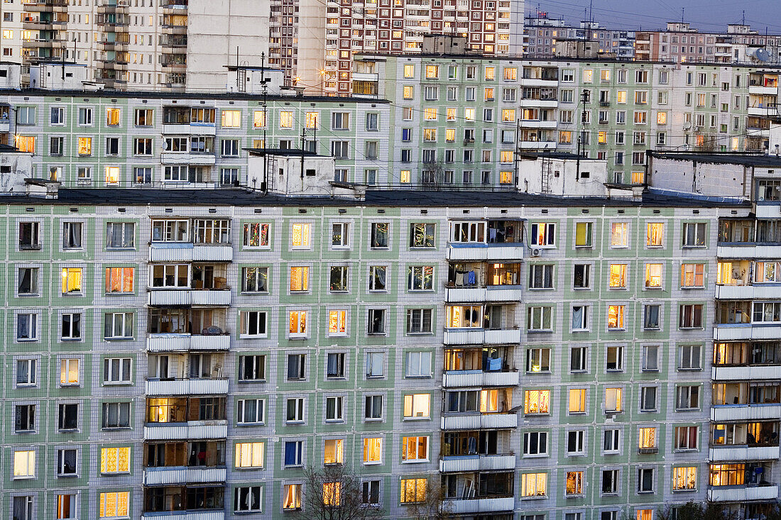 Apartment buildings in the evening with lights in windows, Moscow, Russia