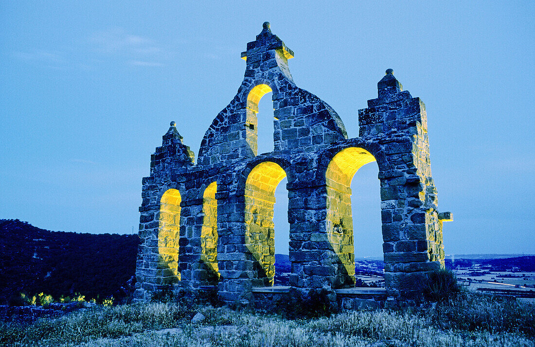 Bell gable at dusk, remains of episcopal castle built in 11th century and rebuilt in 17th. Sanaüja. Segarra, Lleida province, Catalonia, Spain