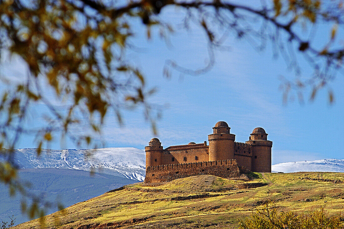 Lacalahorra Castle and Sierra Nevada mountains in background. Granada province, Andalusia. Spain