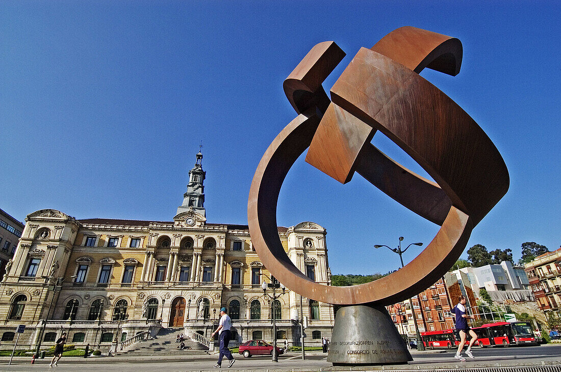 Variante ovoide de la desocupación de la esfera, sculpture by Jorge Oteiza and City Hall in background, Bilbao. Biscay, Euskadi. Spain