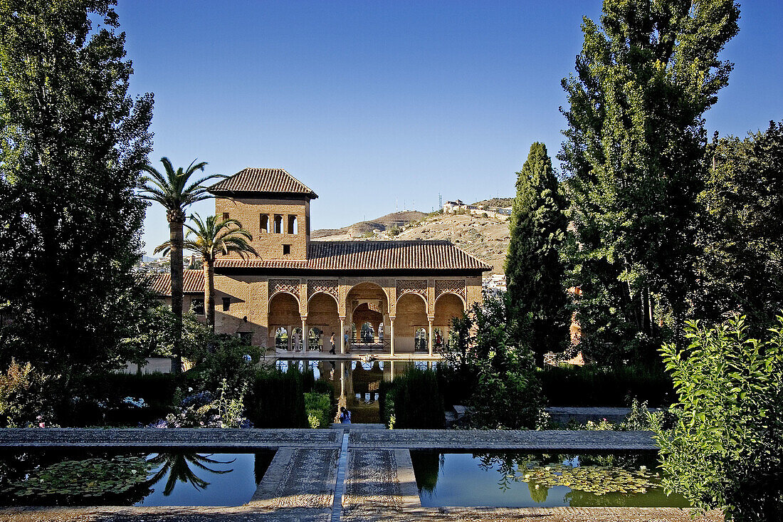 Pond and Ladies Tower. Palacio Nazarí. Partal Gardens. Alhambra. Granada. Andalucia. Spain.