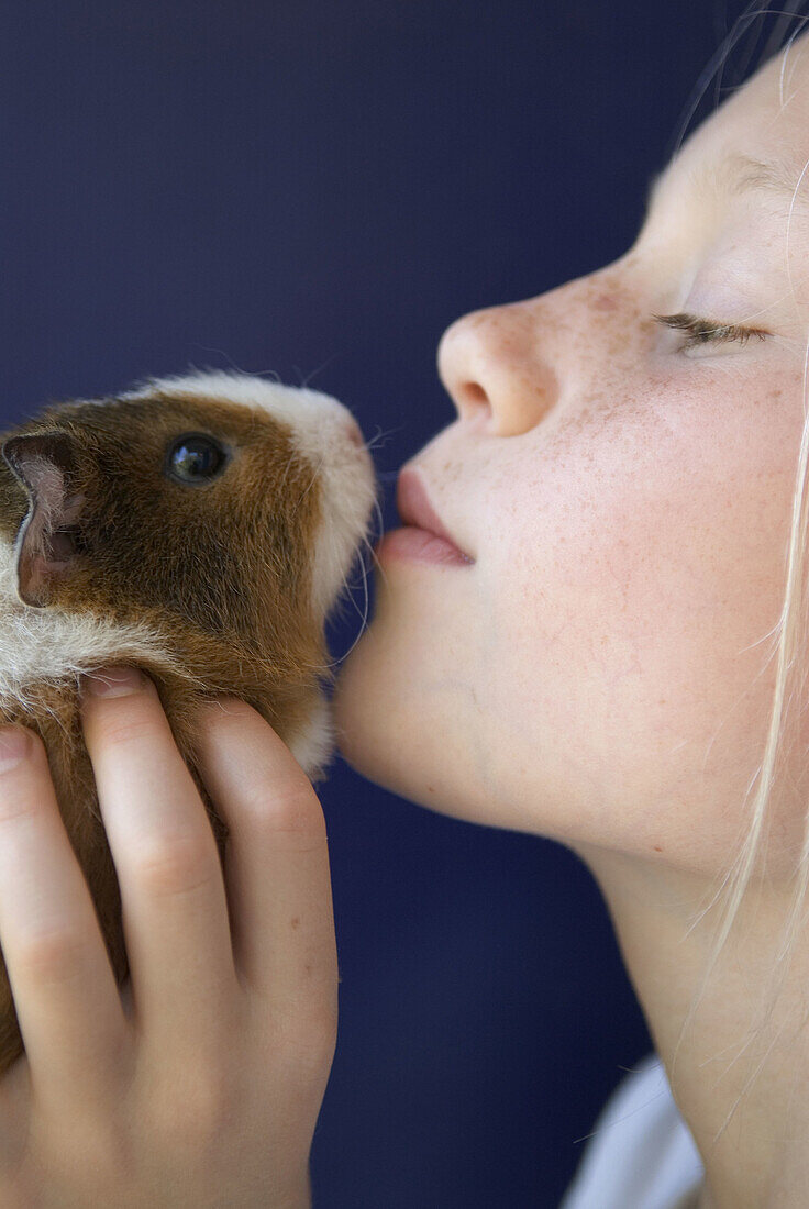 Girl with guinea pig.