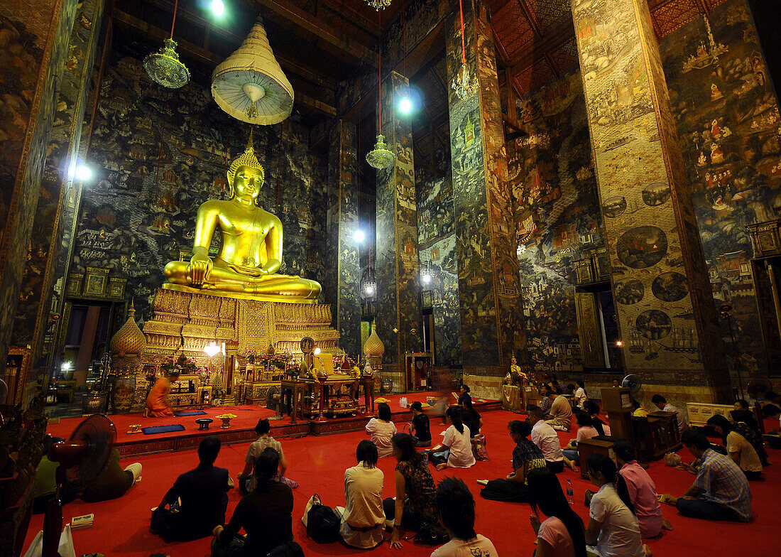 People praying in Wat Suthat, Royal Temple, Bangkok, Thailand