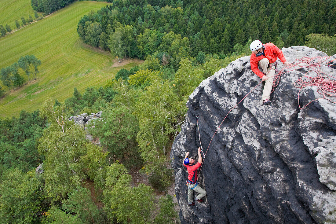 Two climbers on rock, Papststein, Saxon Switzerland, Saxony, Germany