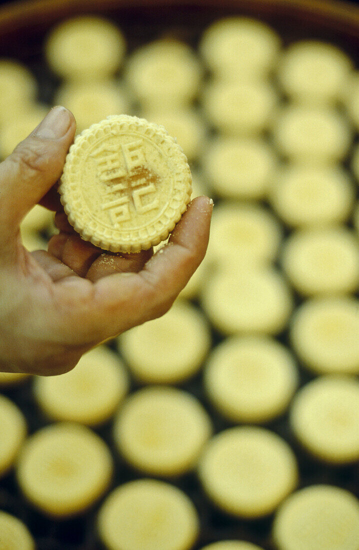 Small cookies are steamed in a shop in Macau. China.