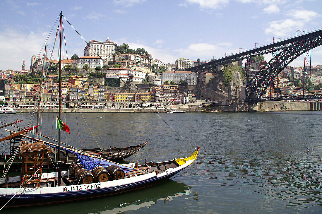 Dom Luis I Bridge and rabelos (typical barges) on Douro river, Vila Nova de Gaia, Porto. Portugal