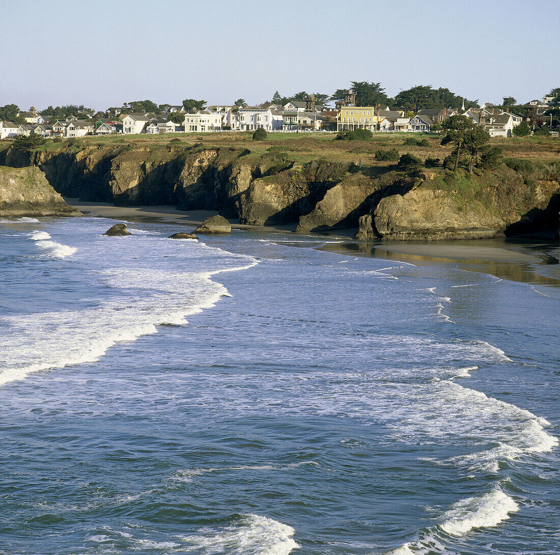 View of town across ocean. Mendocino. Mendocino County. California. USA.