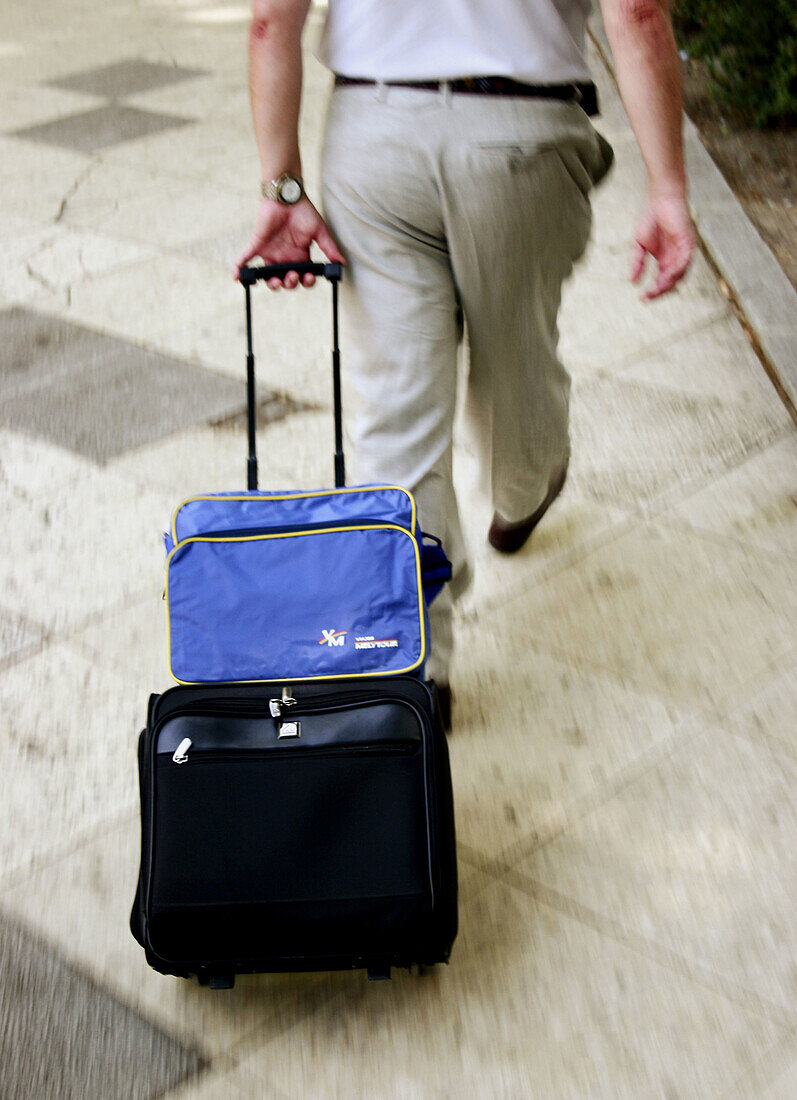 Man with suitcase.