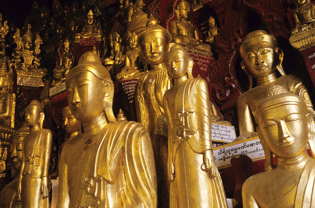 Golden Buddha statues at the entrance of Pindaya cave. Myanmar