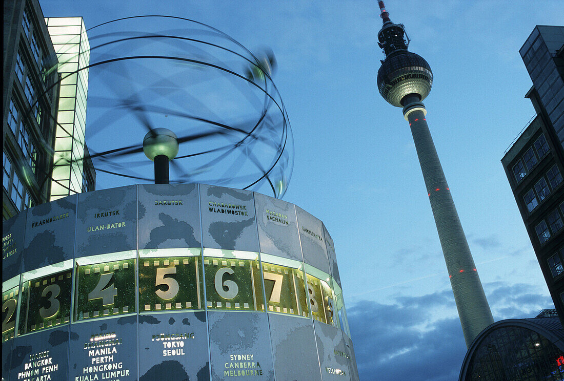 Weltzeituhr (World Time Clock) and Fernsehturm (TV tower) in Alexanderplatz, Berlin. Germany