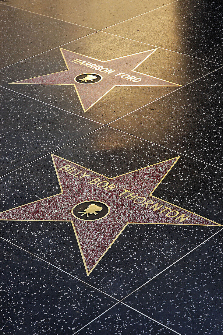 Stars of two celebrities on the Walk of Fame, Hollywood, California.
