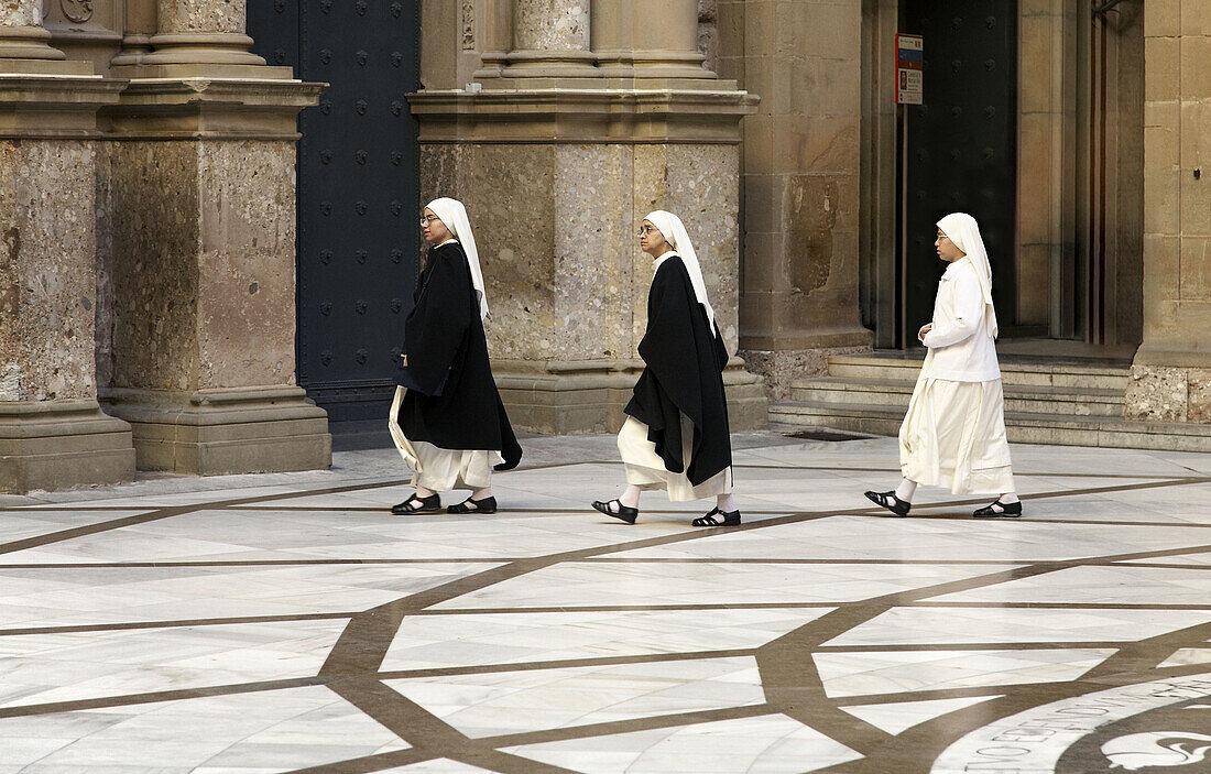 Nuns and novice going to the church.