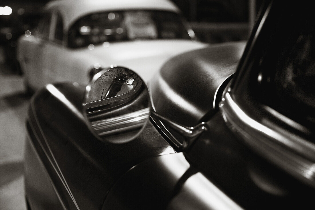 Rearview mirror of a classic car from the 40s or 50s.