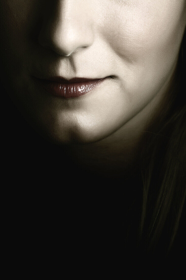 Young womans face. Smile detail.