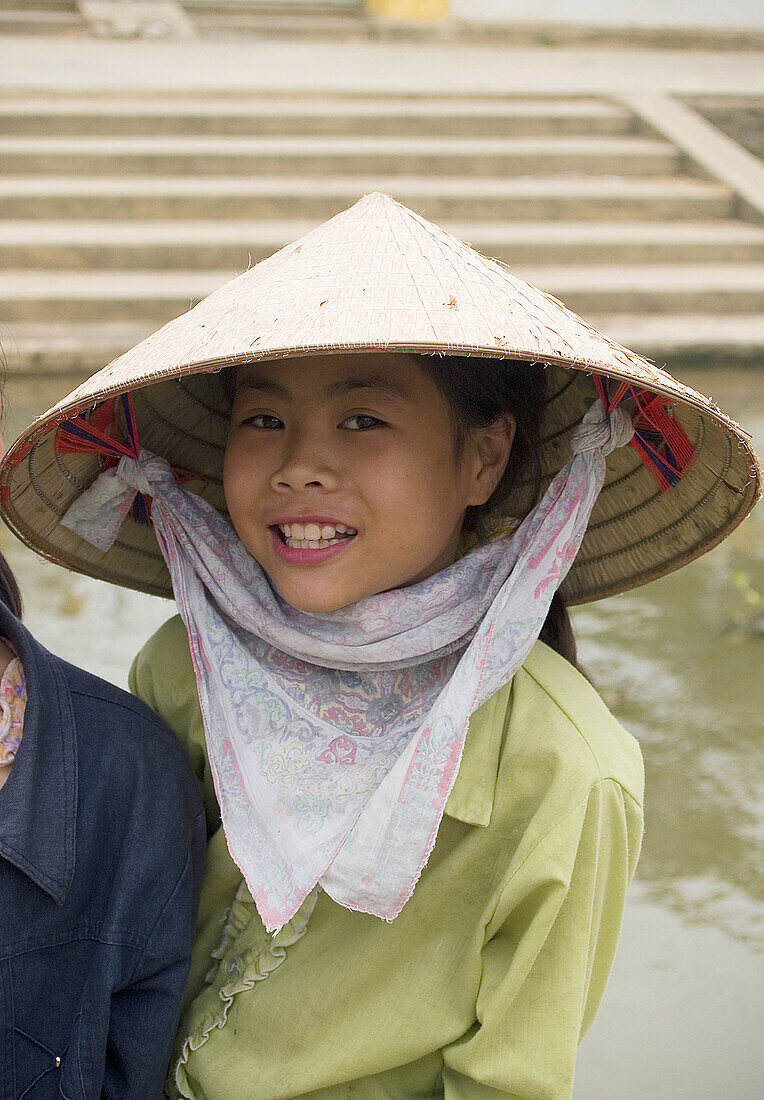 A curious young girl on the floating island of Kenh Ga. Ninh Binh, Vietnam (may 2006)