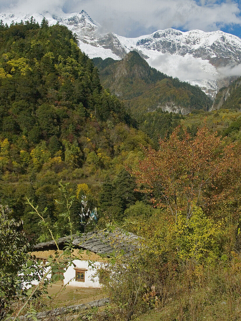 Tibetan home amidst spectacular alpine scenery, Yubeng village, Meili Snow Mountains National Park, Kawa Karpo Range