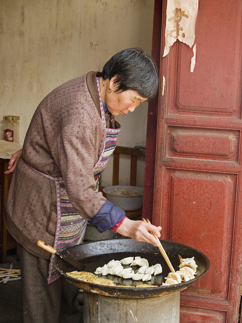 cooking potstickers, Lijiang, China