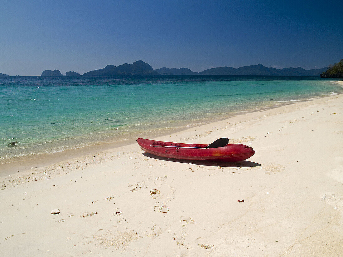 tropical dream, kayak finds one of hundreds of empty islands in the Bacuit Archipelago, Palawan, Philippines