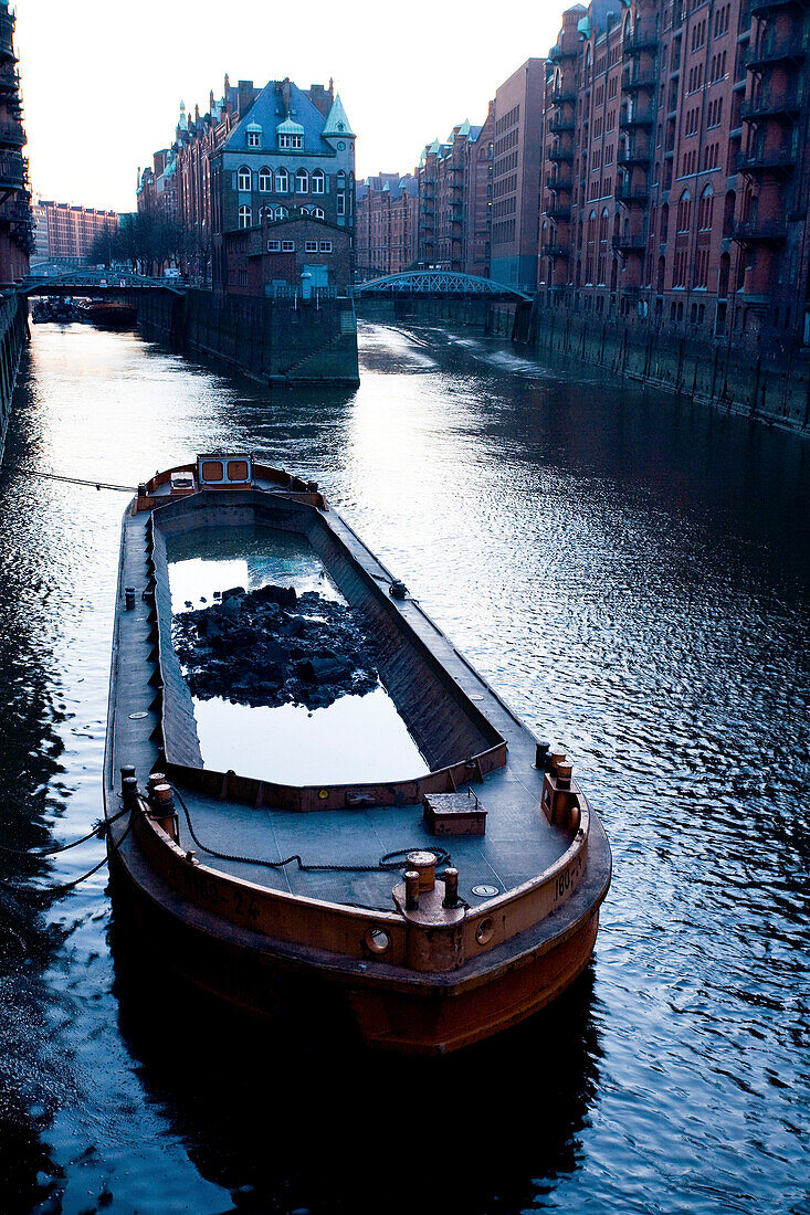 Barge on canal, Speicherstadt, Hamburg, Germany