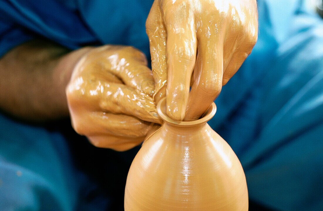 Traditional potter at work. Okinawa. Japan