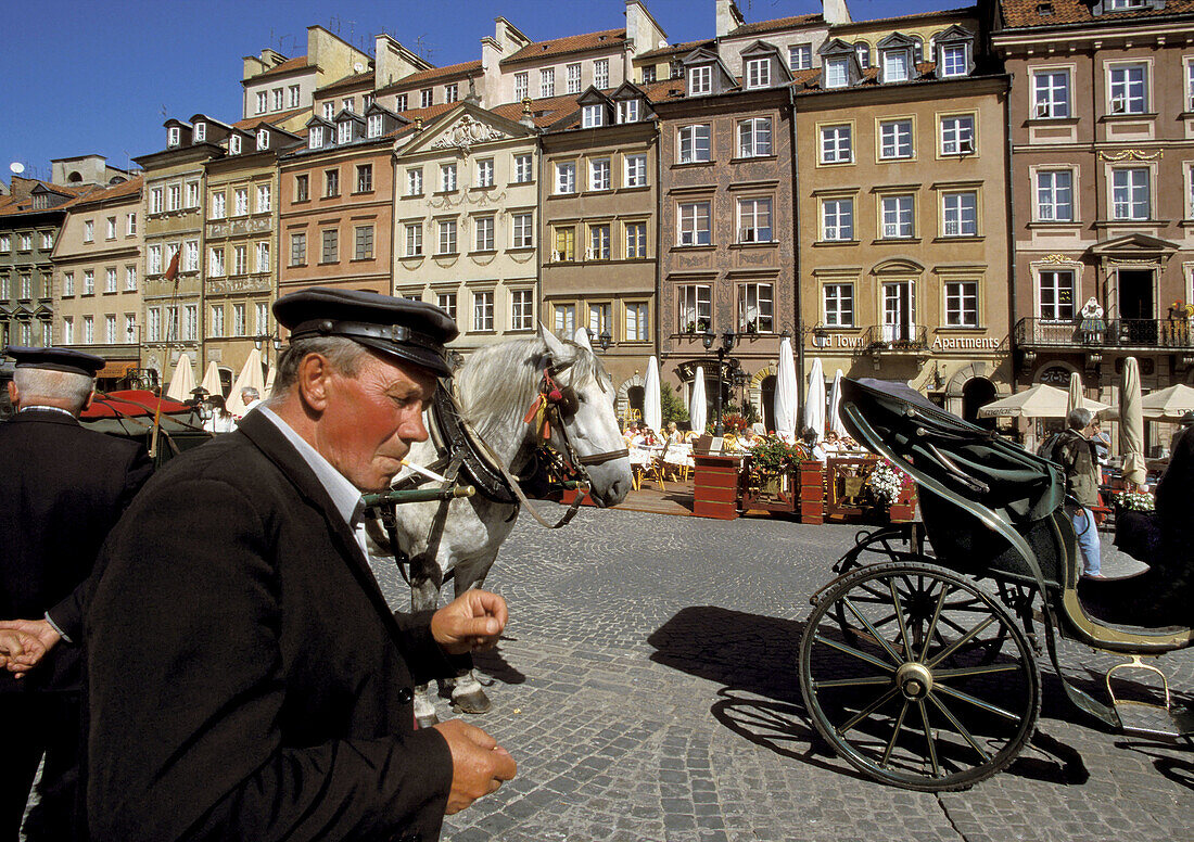 Poland Warsaw, The Old Town ( Stare Miasto ) Square, Partially surrounded by medieval walls is the oldest district in Warsaw, from 13 century, Then main section of Warsaw, Now main tourist attraction with carriages cafes restaurants and shops