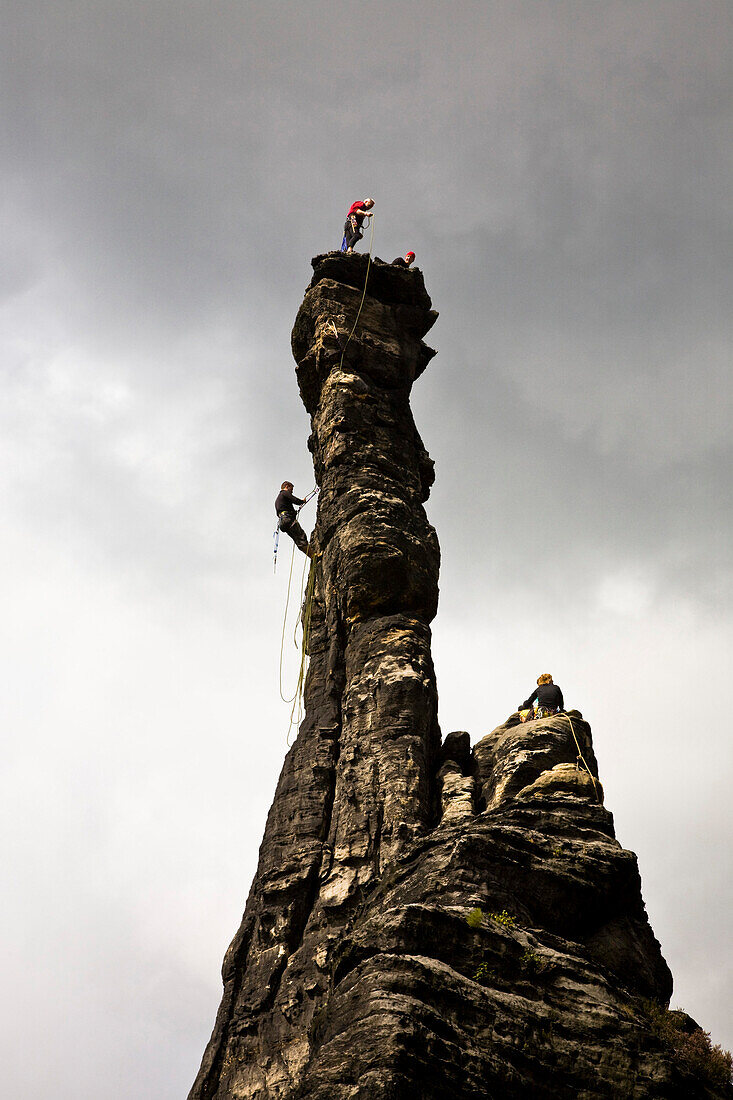 Rock climbers on the towers of the small (left) and large (right) Hercules Column, Bielatal, Elbe Sandstone Mountains, Saxon Switzerland, Saxony, Germany
