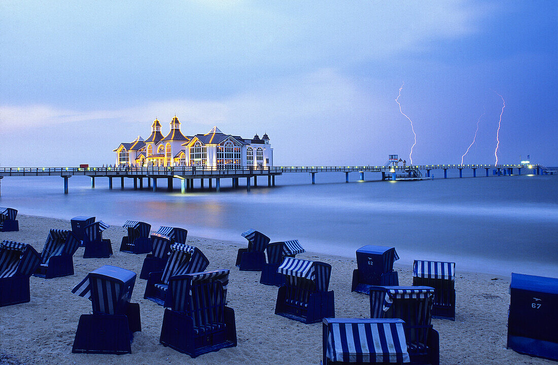 Pier with lightnings in background, Sellin, Rugen island, Mecklenburg-Western Pomerania, Germany