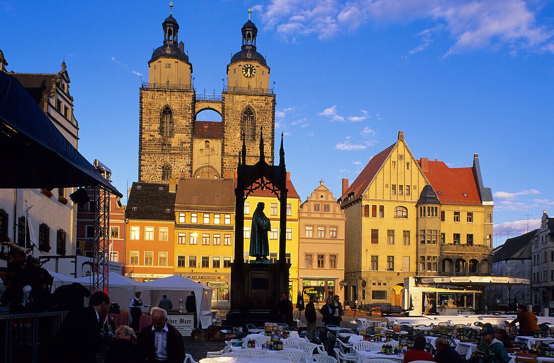 Europe, Germany, Saxony Anhalt, the memorial of Martin Luther on the market square in front of the town hall and Saint Mary's Church in Wittenberg