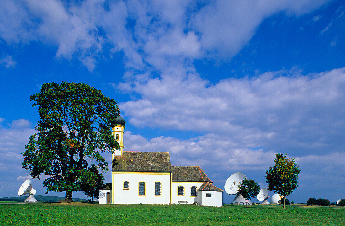 Europe, Germany, Bavaria, near Raisting, Pilgrim church St. Johann and dish antennas of the earth station