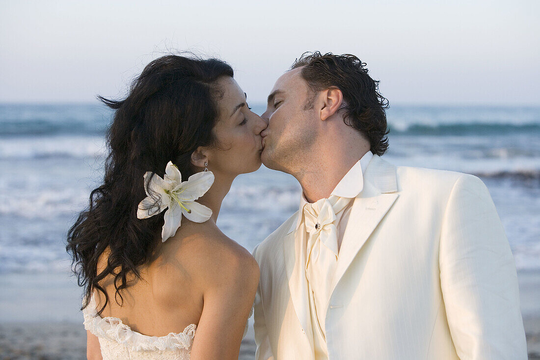 Newly married couple on the beach.