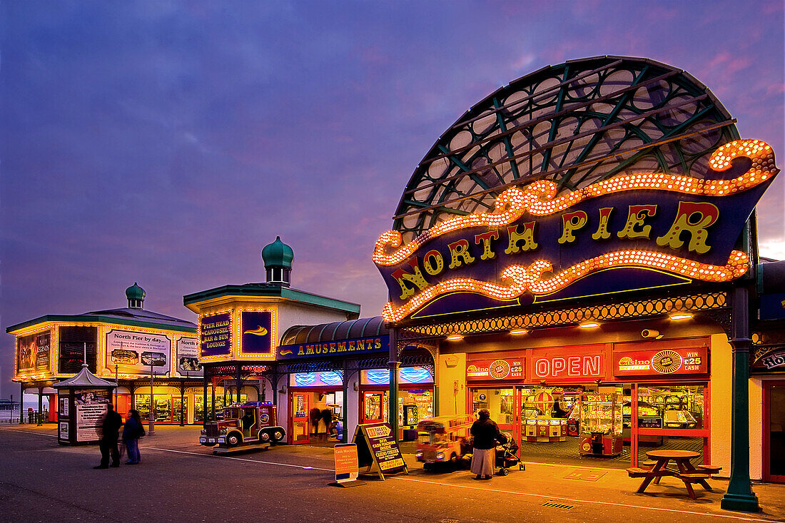 North Pier main entrance at night showing games and slot machines. Blackpool. Lancashire. England. UK