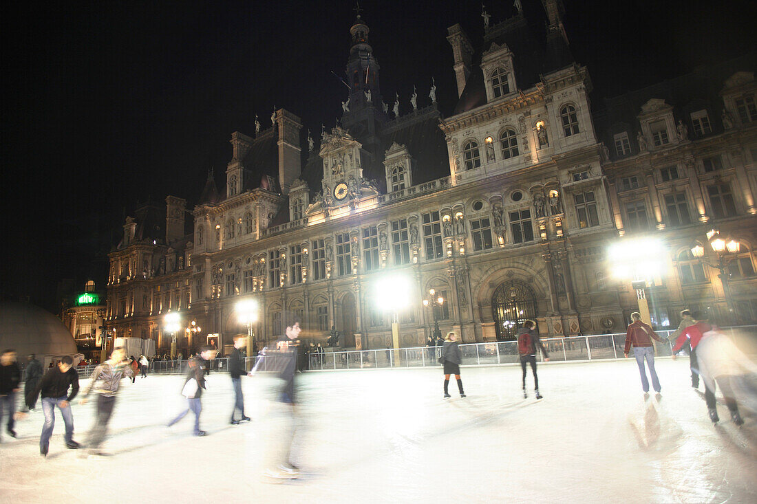 Ice skating in front of Town Hall Hotel de Ville, Paris, France