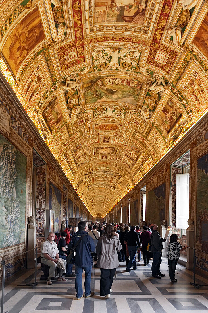 Tourists visiting the Gallery of Maps, Vatican Museums, Vatican City, Rome, Italy