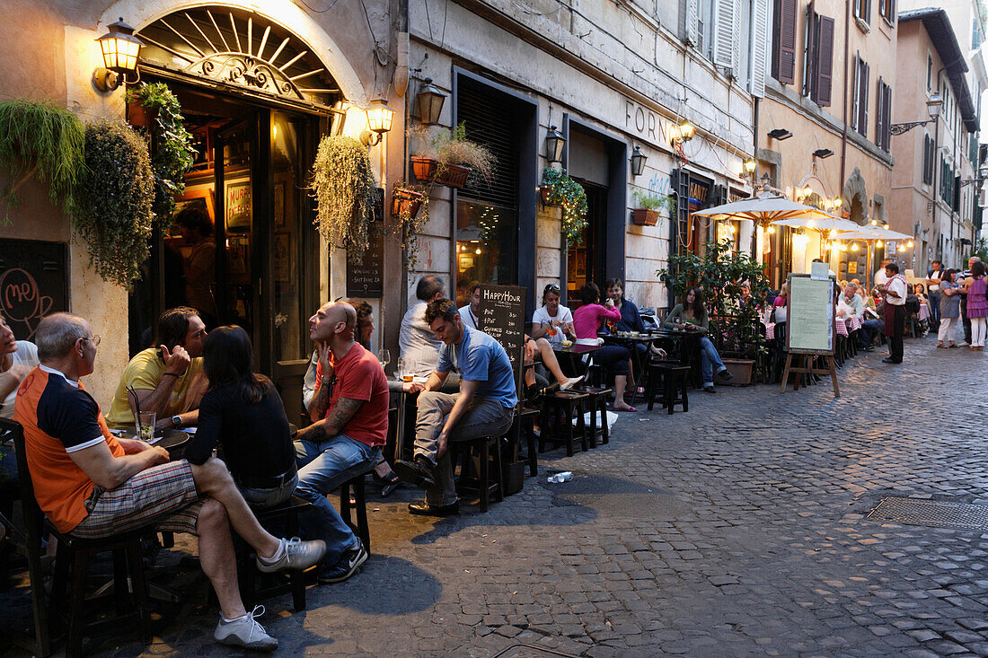 Guests in a pavement cafe, Trastevere, Rome, Italy