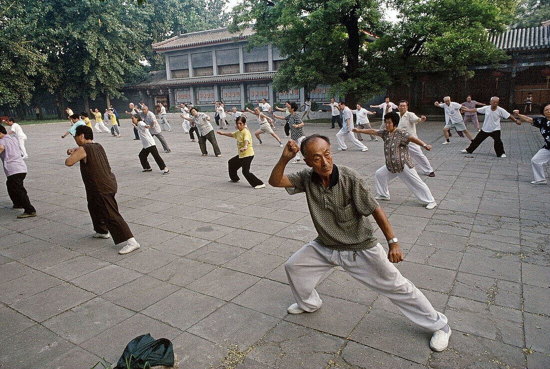 Qigong. People exercising in the morning. Beijing. China.