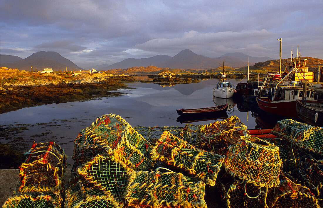 Fishing boats and lobster pots, Ballynakill Harbour, Connemara, Co. Galway, Ireland, Europe