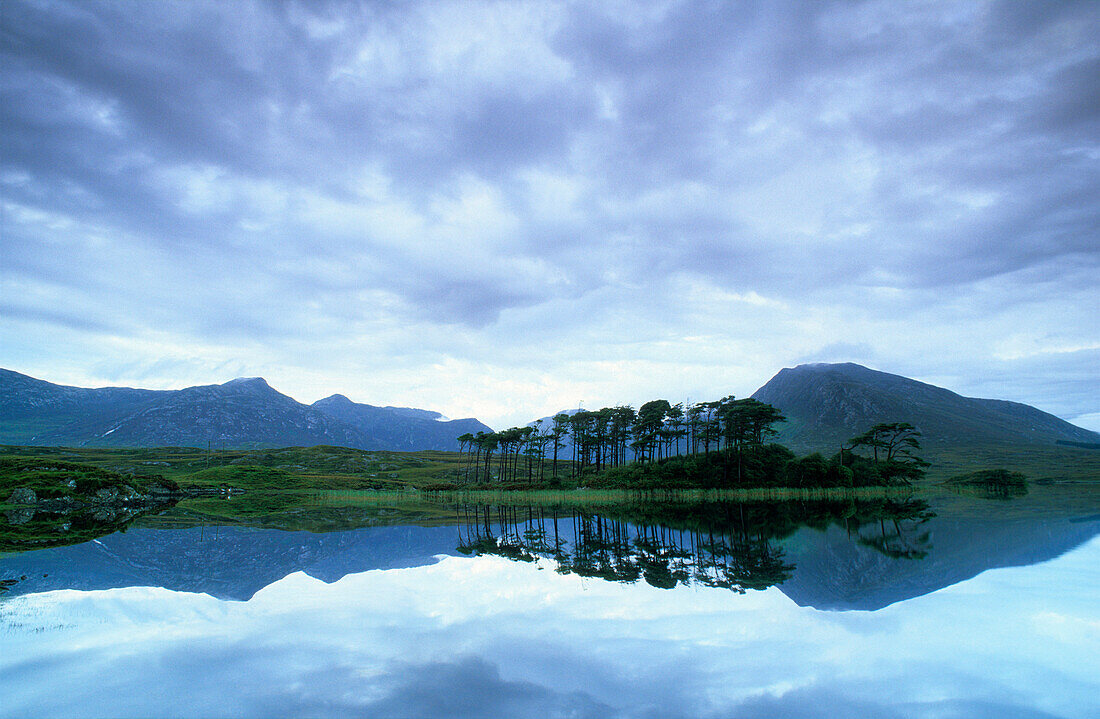 The Ballynahinch Lake reflecting clouds and landscape, Connemara, County Galway, Ireland, Europe