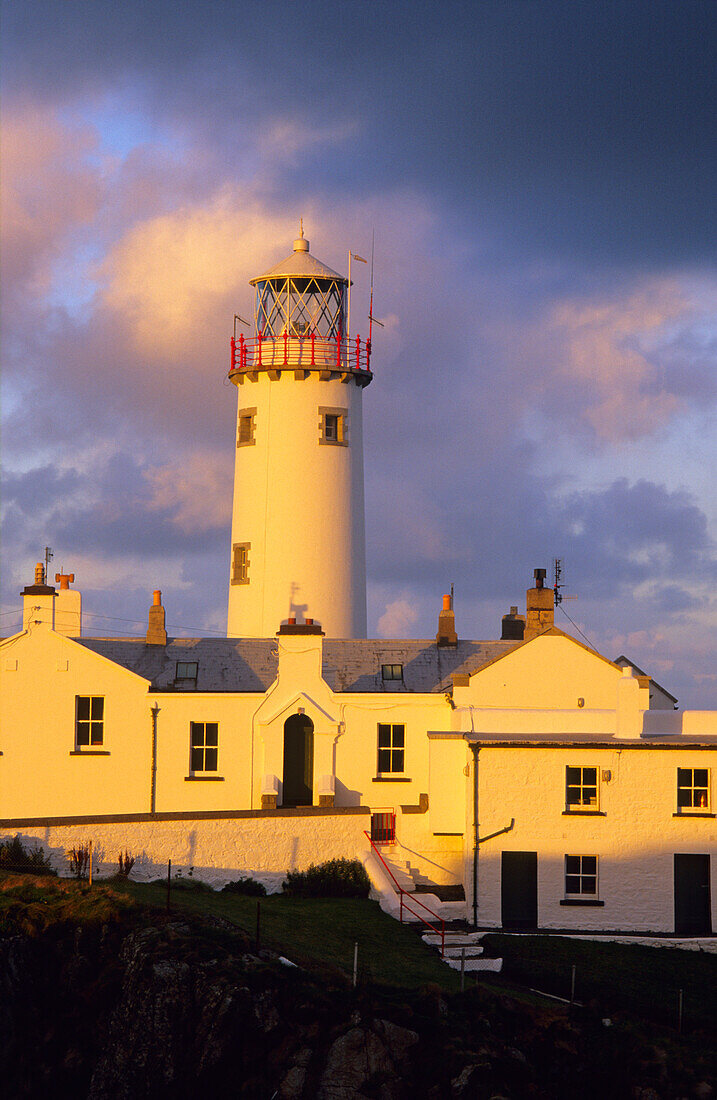 Lighthouse at Fanad Head in the light of the evening sun, County Donegal, Ireland, Europe