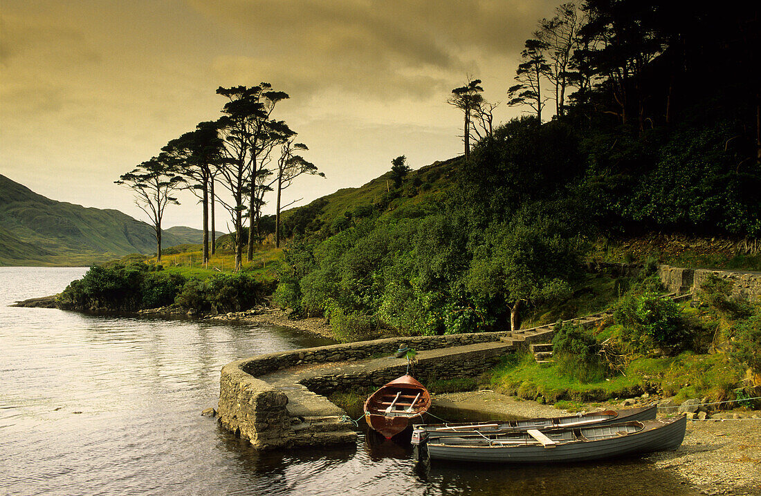 Boats at a jetty at Doo Lough, Connemara, County Mayo, Ireland, Europe