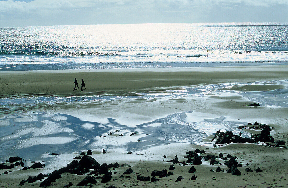 People walking along the beach at St. Finan's Bay, County Kerry, Ireland, Europe