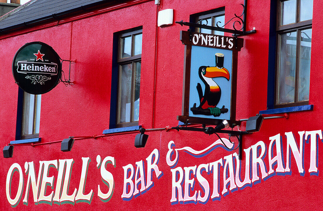 View at the bright red facade of O'Neill's Pub, Allihies, Ring of Beara, County Cork, Ireland, Europe