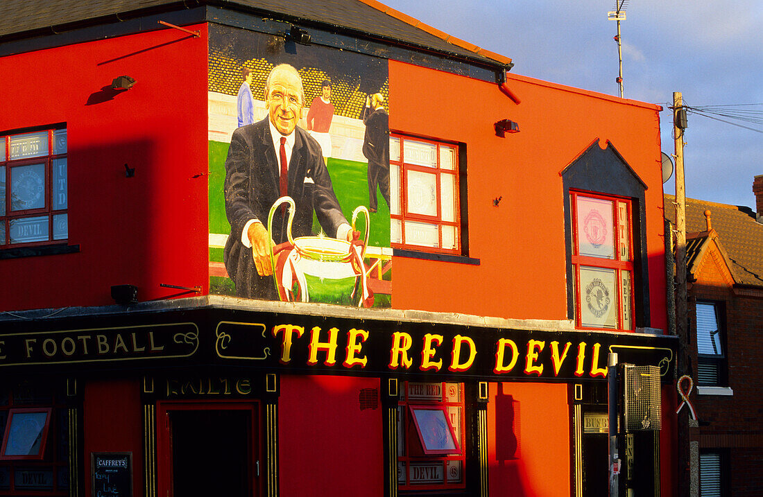 View at the colourfully painted facade of The Red Devil Pub, Belfast, County Antrim, Ireland, Europe