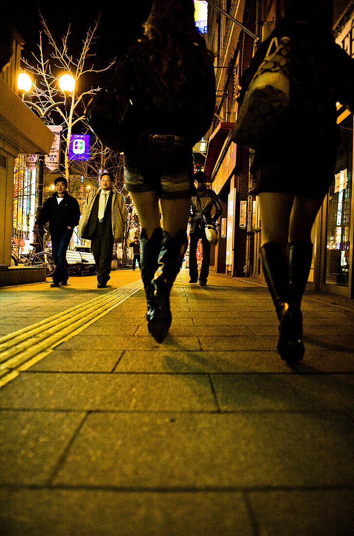 Pedestrians in the town in the evening, Hokkaido, Japan, Asia